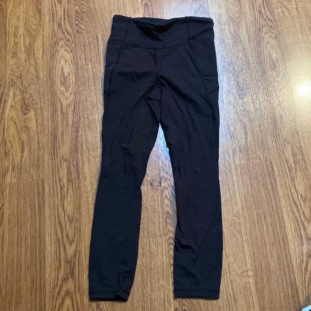 Black Lululemon leggings, slightly cropped, not obnoxiously short. Size 4(XS/S)
